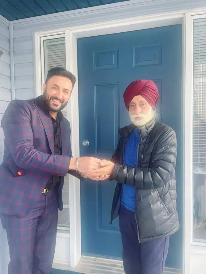 Jasjeet Singh shaking hands with a client at the front door