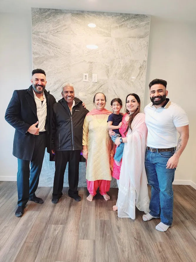 Jasjeet Singh with a client family on closing day